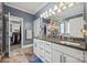 Lovely bathroom with double sinks, granite countertops, and separate walk-in closet at 615 Bourton House Dr, Charlotte, NC 28211
