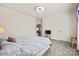 Cozy bedroom boasts neutral carpet and leads to an adjacent room for flexible living at 615 Bourton House Dr, Charlotte, NC 28211