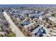 An aerial view of a neighborhood with mature trees, sidewalks, and tree-lined streets on a sunny day at 615 Bourton House Dr, Charlotte, NC 28211
