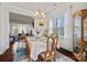 Bright dining room with hardwood floors, chandelier, and view to living room at 615 Bourton House Dr, Charlotte, NC 28211