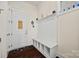 Cozy entryway features a built-in bench with cubbies and a coat rack at 615 Bourton House Dr, Charlotte, NC 28211