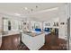 Bright kitchen island with granite counters overlooks the living room in this open floor plan at 615 Bourton House Dr, Charlotte, NC 28211