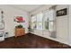 Cozy living area with natural light from big windows, wooden cabinet, and decor at 615 Bourton House Dr, Charlotte, NC 28211