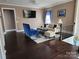 Cozy living room area featuring hardwood floors, modern furniture, and natural light at 615 Bourton House Dr, Charlotte, NC 28211
