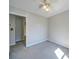 Comfortable bedroom featuring a doorway and neutral walls with carpet flooring at 702 Selma Burke Ln, Matthews, NC 28105