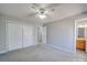 Spacious bedroom with neutral tones, carpet flooring, and closet storage at 702 Selma Burke Ln, Matthews, NC 28105