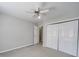 Inviting bedroom featuring a ceiling fan and closet with neutral-toned walls at 702 Selma Burke Ln, Matthews, NC 28105