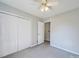Cozy bedroom featuring a closet, doorway, and a ceiling fan at 702 Selma Burke Ln, Matthews, NC 28105