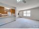 Cozy living space flows into kitchen area, with a breakfast bar at 702 Selma Burke Ln, Matthews, NC 28105