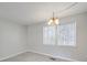Bright living room with neutral walls, carpet, natural light and chandelier at 702 Selma Burke Ln, Matthews, NC 28105