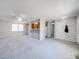 Open-concept living area with neutral tones, carpet flooring, and lots of natural light at 702 Selma Burke Ln, Matthews, NC 28105