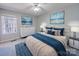 Comfortable main bedroom featuring a large bed, artwork, and natural light at 702 Selma Burke Ln, Matthews, NC 28105