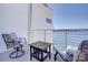 Lakefront balcony features chairs, a table, and beautiful views of the water at 7111 Anchorage Ln, Tega Cay, SC 29708