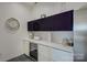 Wet bar with white counter tops and wine refrigerator at 7111 Anchorage Ln, Tega Cay, SC 29708