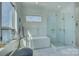 Sunlit bathroom showcases a soaking tub and glass-enclosed shower for a spa-like experience at 7111 Anchorage Ln, Tega Cay, SC 29708