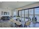 Modern open concept dining room with seating and a great lake view at 7111 Anchorage Ln, Tega Cay, SC 29708