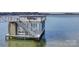 Modern dock with a staircase and deck to access the water at 7111 Anchorage Ln, Tega Cay, SC 29708