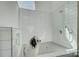 This tiled dog wash room features a shower fixture and decorative tile to make cleaning up easy and fun at 7111 Anchorage Ln, Tega Cay, SC 29708