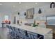Modern open kitchen with a large center island, stainless steel appliances, and bar seating at 7111 Anchorage Ln, Tega Cay, SC 29708