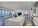 Bright, open-concept kitchen with large center island, modern appliances, and eat in kitchen space at 7111 Anchorage Ln, Tega Cay, SC 29708