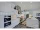 Bright modern kitchen with custom cabinets, stainless steel appliances, and sleek countertops at 7111 Anchorage Ln, Tega Cay, SC 29708