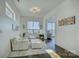 Living room with hardwood floors and sliding glass doors at 7111 Anchorage Ln, Tega Cay, SC 29708