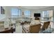 The living room features scenic lake views from large windows, and an open floor plan concept at 7111 Anchorage Ln, Tega Cay, SC 29708