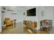 Living room featuring hard wood floors, modern furniture, and large tv at 7111 Anchorage Ln, Tega Cay, SC 29708