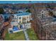 Modern home featuring multiple balconies, a pool, and a stairway to the yard at 7111 Anchorage Ln, Tega Cay, SC 29708