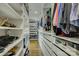 This walk-in closet offers ample storage with custom shelving and organizational features at 7111 Anchorage Ln, Tega Cay, SC 29708