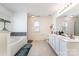 Bright bathroom featuring double sinks, a separate tub, and a shower, offering comfort and convenience at 757 Jones Branch Rd, Fort Mill, SC 29715