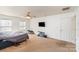 A large bedroom with lots of sunlight, carpet floors, and a ceiling fan at 757 Jones Branch Rd, Fort Mill, SC 29715