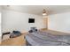 Large bedroom with neutral walls, carpet, and a ceiling fan, offering a comfortable and serene space at 757 Jones Branch Rd, Fort Mill, SC 29715