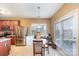 Kitchen area with stainless steel appliances and a glass table for dining, flooded with natural light at 757 Jones Branch Rd, Fort Mill, SC 29715