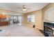 Inviting living room featuring a cozy fireplace, and an open floor plan with easy access to the kitchen at 757 Jones Branch Rd, Fort Mill, SC 29715