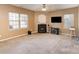 Spacious living room featuring a fireplace, large windows, and neutral paint, creating a bright and airy atmosphere at 757 Jones Branch Rd, Fort Mill, SC 29715