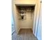 Walk-in closet with custom shelving and modern laminate flooring at 7804 Renaissance Ct # A, Charlotte, NC 28226
