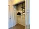 Walk-in closet with adjustable shelving system and modern organizers at 7804 Renaissance Ct # A, Charlotte, NC 28226
