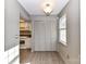 A dining area featuring bi-fold closet, a window providing natural light, and hardwood style flooring at 7804 Renaissance Ct # A, Charlotte, NC 28226