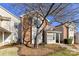 Charming townhouse with a brick and vinyl exterior and well-maintained front yard at 7804 Renaissance Ct # A, Charlotte, NC 28226