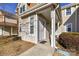 Inviting townhouse entrance featuring a covered porch and a well-lit doorway at 7804 Renaissance Ct # A, Charlotte, NC 28226