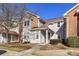 Charming townhouse with a brick and vinyl exterior and well-maintained front yard at 7804 Renaissance Ct # A, Charlotte, NC 28226