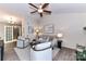 Cozy living room with vaulted ceiling, ceiling fan, neutral color palette, and stylish furnishings at 7804 Renaissance Ct # A, Charlotte, NC 28226