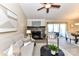 Inviting living room featuring a fireplace, vaulted ceiling, and neutral decor at 7804 Renaissance Ct # A, Charlotte, NC 28226