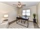 Bright office with a ceiling fan and a large window for natural light perfect for work or study at 7804 Renaissance Ct # A, Charlotte, NC 28226