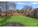 Picture of a large backyard featuring a lush green lawn, complemented by a stylish pergola and a privacy fence at 888 Craigmont Nw Ln, Concord, NC 28027