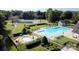 Community amenities feature a pristine pool area, a pool, a tennis court, and landscaped grounds for relaxation at 888 Craigmont Nw Ln, Concord, NC 28027