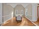 Elegant dining area featuring high ceilings, natural light, and hardwood floors at 888 Craigmont Nw Ln, Concord, NC 28027
