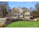 Well-manicured lawn and beautiful landscaping surround this charming traditional home at 888 Craigmont Nw Ln, Concord, NC 28027