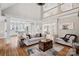 Open-concept living space featuring hardwood floors and modern decor at 888 Craigmont Nw Ln, Concord, NC 28027